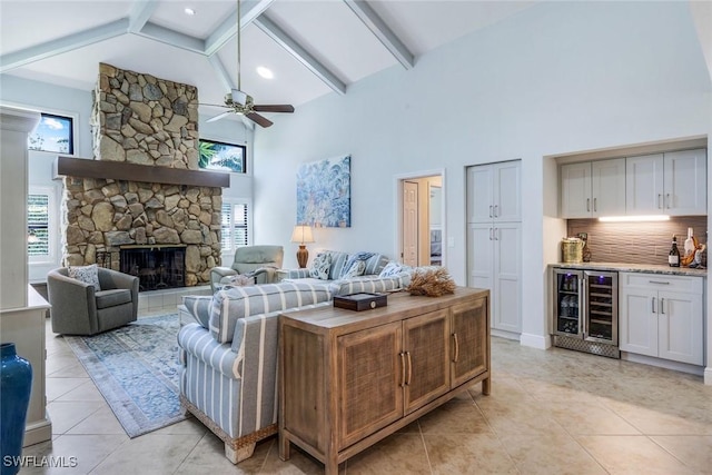 16902 Timberlakes Dr, Fort Myers, FL 33908 - living room featuring wine cooler, high vaulted ceiling, light tile patterned floors, a bar, and a ceiling fan