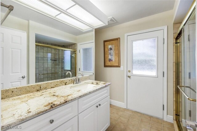 16902 Timberlakes Dr, Fort Myers, FL 33908 - bathroom with baseboards, a shower stall, vanity, and tile patterned flooring