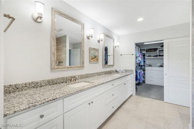 16902 Timberlakes Dr, Fort Myers, FL 33908 - full bathroom featuring double vanity, a spacious closet, marble finish floors, and recessed lighting