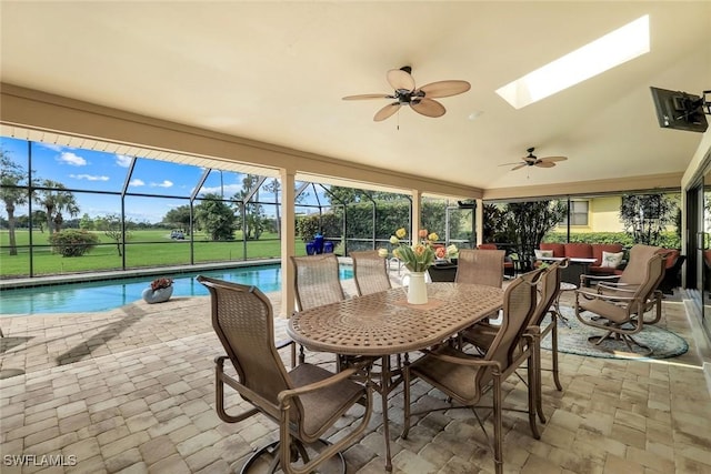 16902 Timberlakes Dr, Fort Myers, FL 33908 - sunroom with ceiling fan, a pool, an outdoor living space, vaulted ceiling, and a skylight