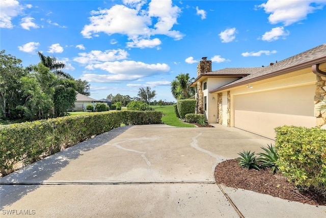 16902 Timberlakes Dr, Fort Myers, FL 33908 - view of patio with concrete driveway and a garage