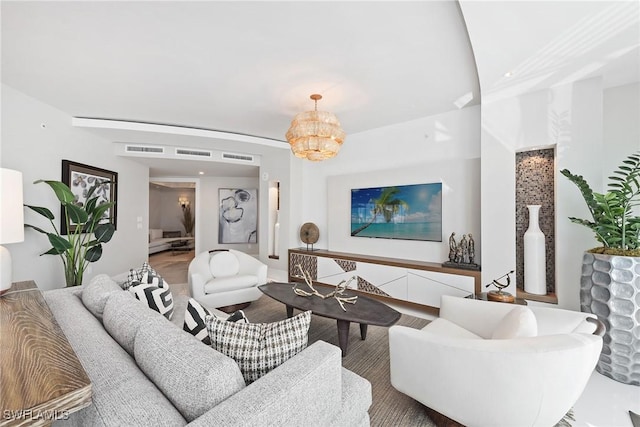living room featuring a chandelier and visible vents