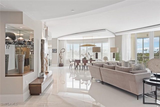 living area with baseboards, visible vents, and recessed lighting