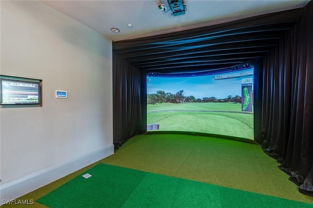 game room with golf simulator, carpet floors, and baseboards