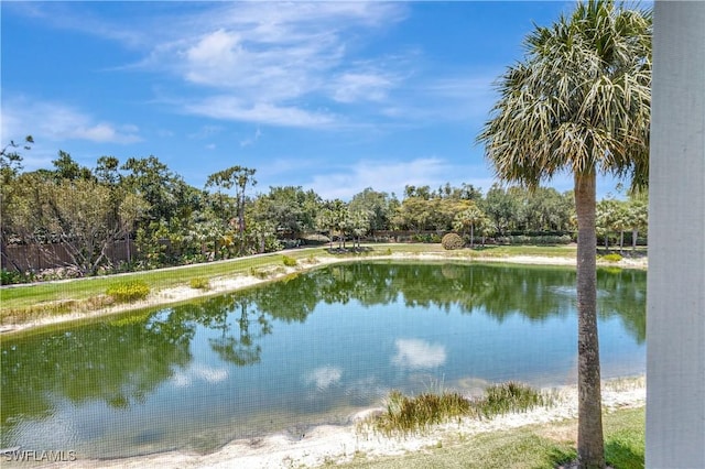 property view of water featuring fence
