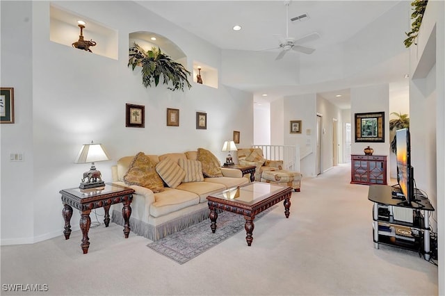 living room with ceiling fan, light carpet, visible vents, and recessed lighting