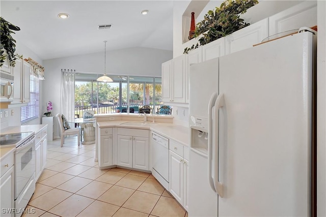 kitchen with a sink, white appliances, visible vents, vaulted ceiling, and white cabinets