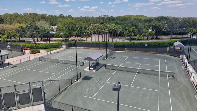 view of sport court with fence