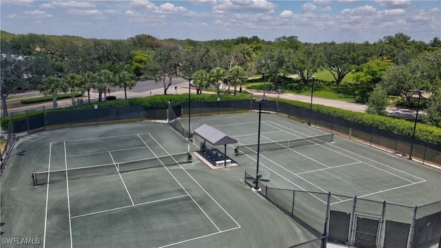 view of sport court with fence