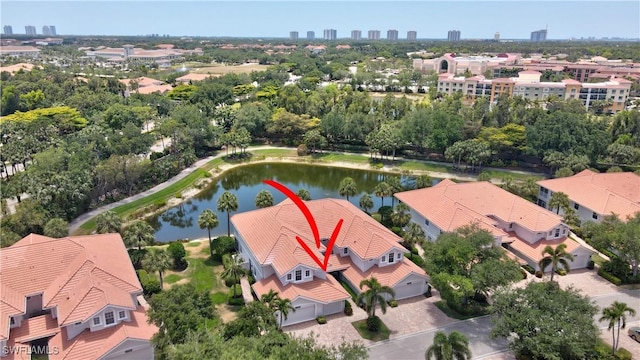 bird's eye view featuring a water view and a view of city