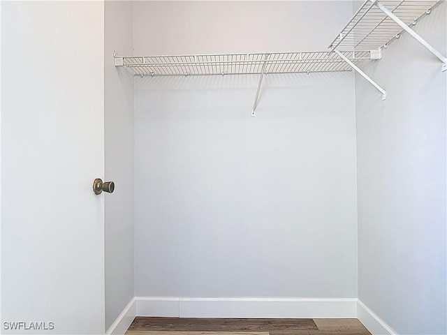 2178 Arbour Walk Cir Unit 2322, Naples, FL 34109 - spacious closet with wood finished floors