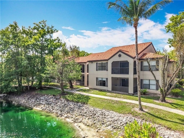 2178 Arbour Walk Cir Unit 2322, Naples, FL 34109 - back of house featuring stucco siding