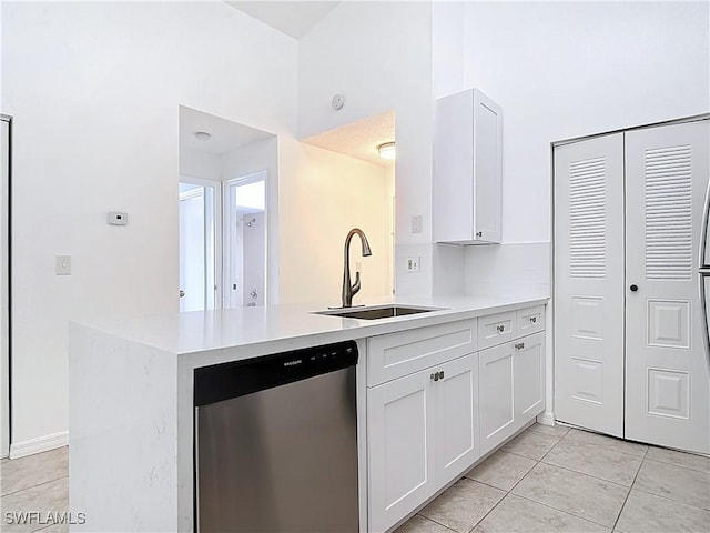 2178 Arbour Walk Cir Unit 2322, Naples, FL 34109 - kitchen featuring dishwasher, a sink, white cabinetry, and light tile patterned floors