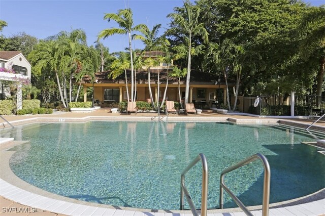 2178 Arbour Walk Cir Unit 2322, Naples, FL 34109 - community pool featuring a patio area