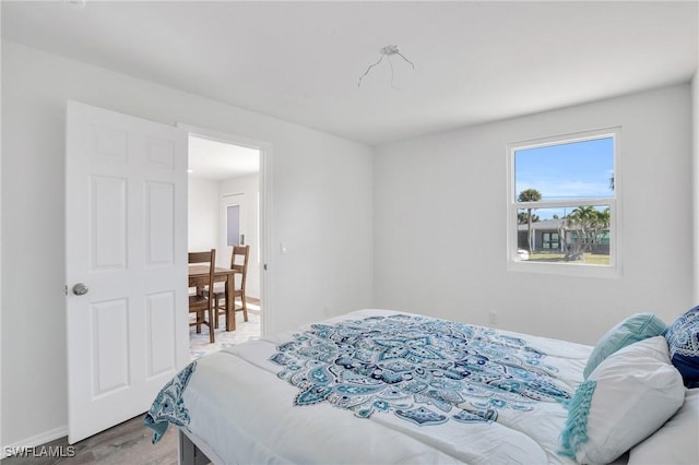 351 Jefferson Ct, Fort Myers Beach, FL 33931 - bedroom with light wood-style floors and baseboards