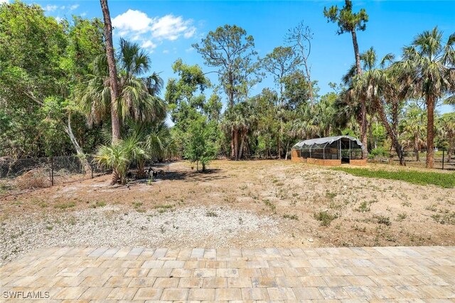 2855 66th St SW, Naples, FL 34105 - view of yard featuring an outdoor structure and a detached carport