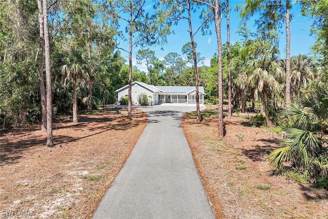 2855 66th St SW, Naples, FL 34105 - view of front of home featuring asphalt driveway