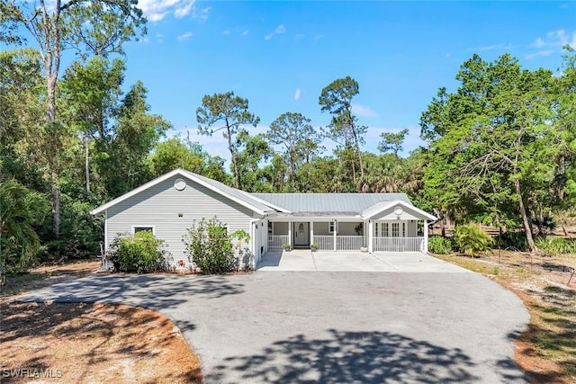 2855 66th St SW, Naples, FL 34105 - single story home with a porch and concrete driveway