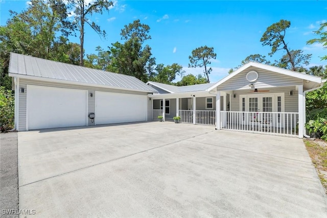 2855 66th St SW, Naples, FL 34105 - single story home with metal roof, covered porch, and ceiling fan