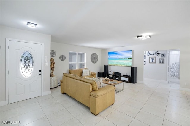 2855 66th St SW, Naples, FL 34105 - living area featuring light tile patterned floors and baseboards