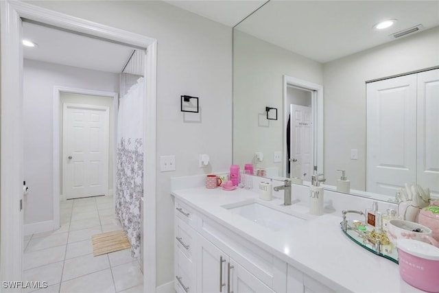 2855 66th St SW, Naples, FL 34105 - full bathroom featuring vanity, tile patterned flooring, and baseboards