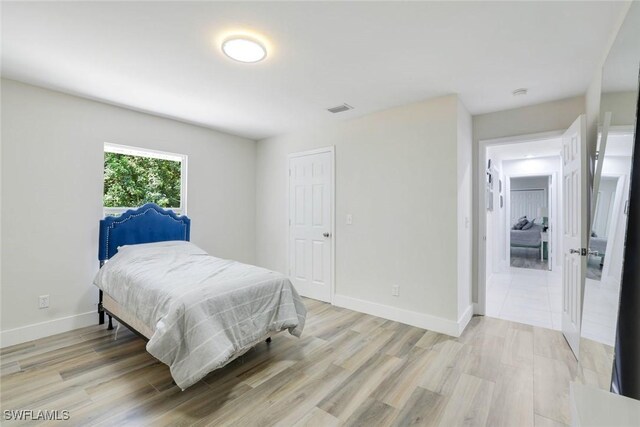 2855 66th St SW, Naples, FL 34105 - bedroom featuring light wood-type flooring and baseboards