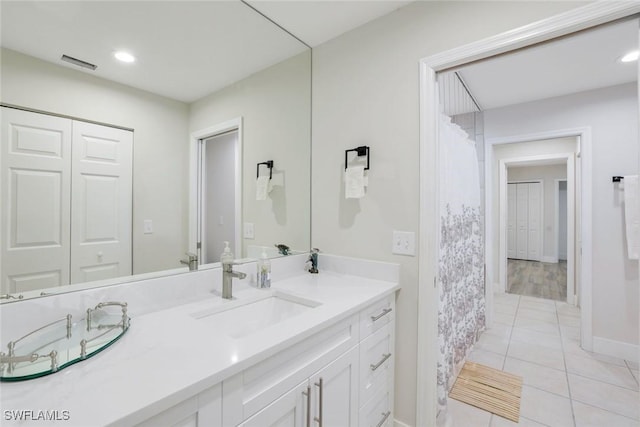 2855 66th St SW, Naples, FL 34105 - bathroom featuring vanity, tile patterned floors, baseboards, recessed lighting, and a shower with curtain