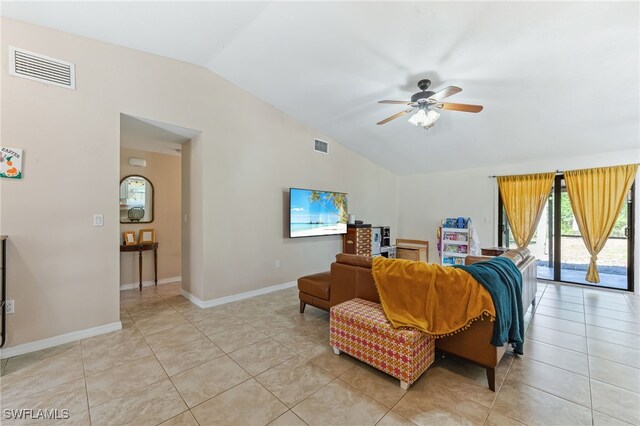 living room with visible vents, light tile patterned flooring, ceiling fan, and lofted ceiling