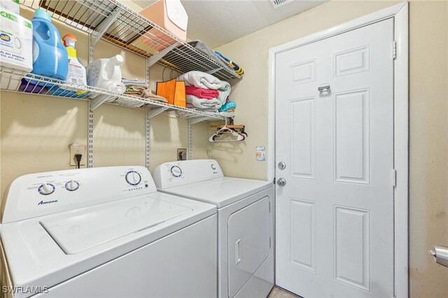 laundry area with laundry area and washing machine and dryer