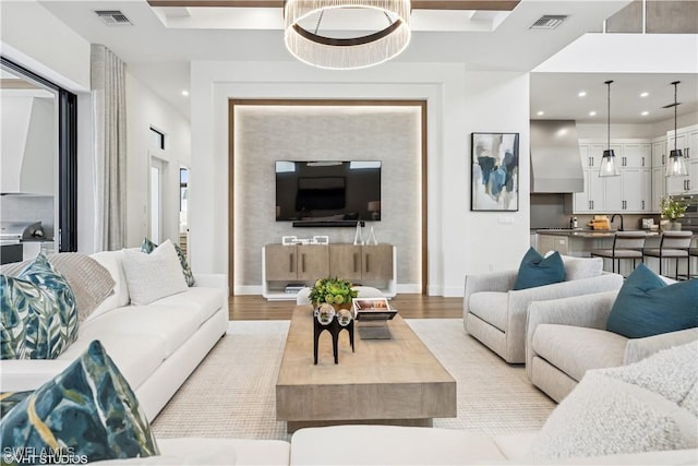 living area with recessed lighting, baseboards, and visible vents