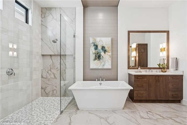 bathroom with vanity, marble finish floor, a marble finish shower, and a freestanding bath