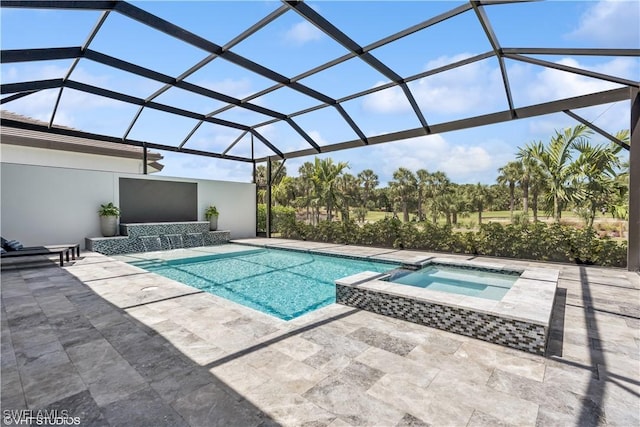view of pool featuring a patio, a lanai, and a pool with connected hot tub