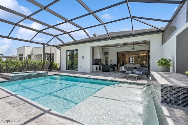 rear view of house featuring a lanai, a patio area, stucco siding, and a pool with connected hot tub