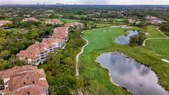 aerial view with a water view and view of golf course