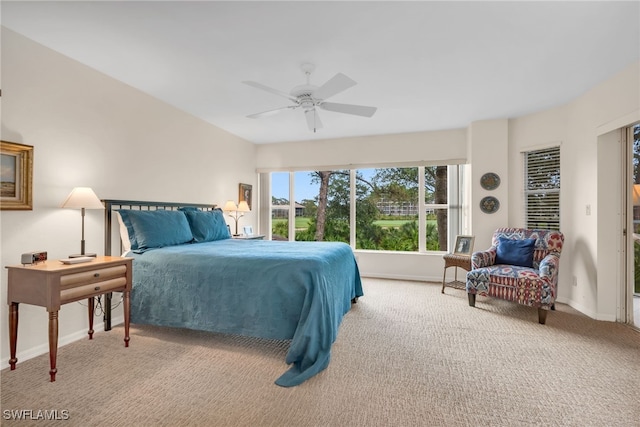 bedroom featuring carpet floors, a ceiling fan, and baseboards