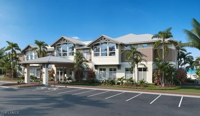 view of building exterior with uncovered parking