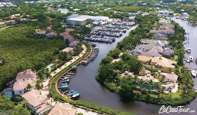 birds eye view of property with a water view and a residential view