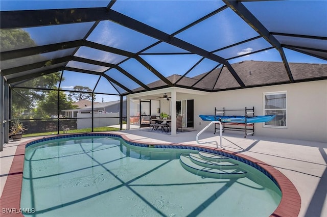 1045 SW Embers Ter, Cape Coral, FL 33991 - outdoor pool featuring a patio, a ceiling fan, and a lanai
