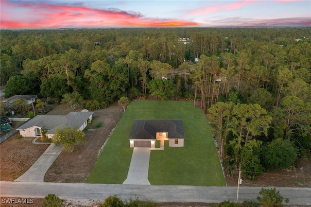 bird's eye view featuring a forest view