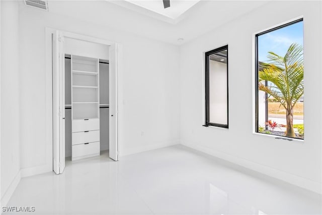 845 SW 15th Ter, Cape Coral, FL 33991 - unfurnished bedroom with visible vents, baseboards, a closet, and multiple windows