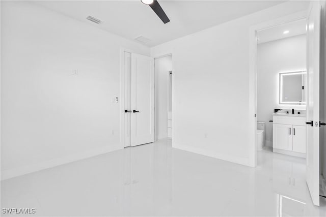 845 SW 15th Ter, Cape Coral, FL 33991 - unfurnished bedroom featuring connected bathroom, a ceiling fan, baseboards, light tile patterned floors, and visible vents