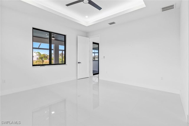 845 SW 15th Ter, Cape Coral, FL 33991 - unfurnished room featuring visible vents, a raised ceiling, ceiling fan, and tile patterned flooring