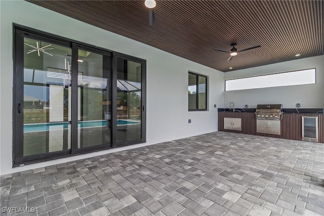 845 SW 15th Ter, Cape Coral, FL 33991 - view of patio / terrace with a sink, beverage cooler, area for grilling, an outdoor kitchen, and a ceiling fan