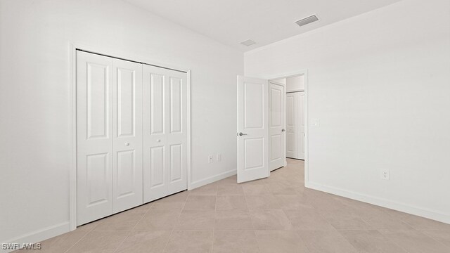 3036 Weston Manor Dr, Alva, FL 33920 - unfurnished bedroom with baseboards, visible vents, and a closet