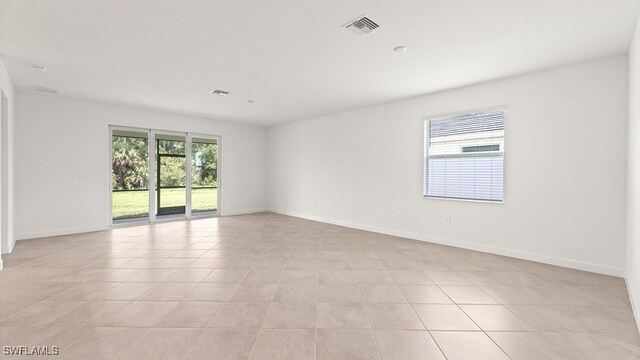 3036 Weston Manor Dr, Alva, FL 33920 - spare room featuring baseboards, light tile patterned flooring, and visible vents