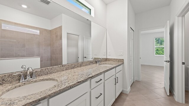 3036 Weston Manor Dr, Alva, FL 33920 - full bath with double vanity, tile patterned floors, visible vents, and a sink