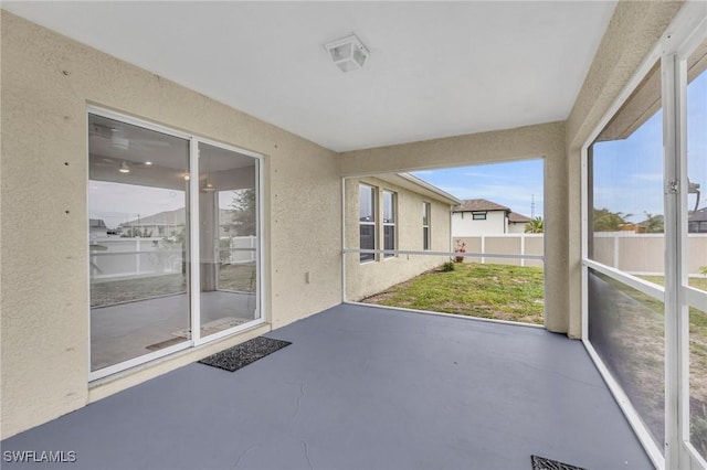 unfurnished sunroom featuring plenty of natural light