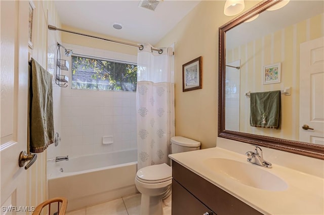 full bath featuring vanity, toilet, tile patterned floors, shower / bath combo with shower curtain, and visible vents