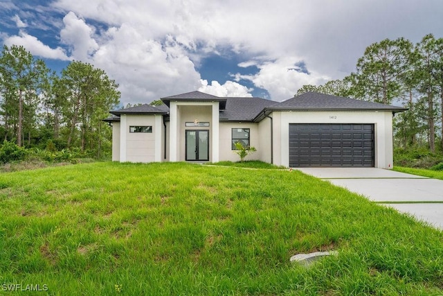 1412 5th Ave, Lehigh Acres, FL 33972 - prairie-style home with an attached garage, stucco siding, concrete driveway, and a front lawn