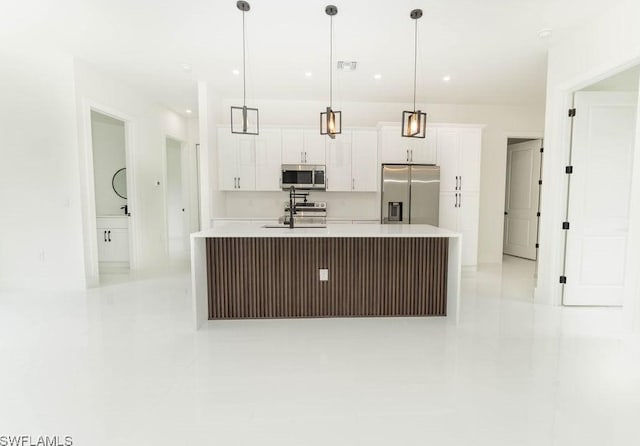 1412 5th Ave, Lehigh Acres, FL 33972 - kitchen with appliances with stainless steel finishes, light tile patterned flooring, white cabinetry, light countertops, and recessed lighting